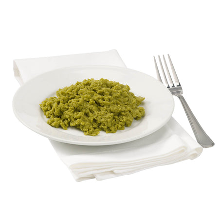 Green dish on a white plate with a fork on a white background.