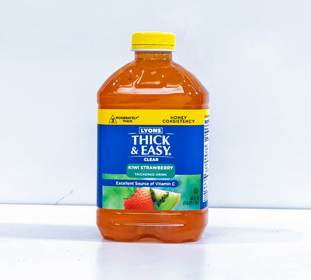 Bottle of Lyons Thick & Easy Kivi Strawberry thickened drink on a white background.