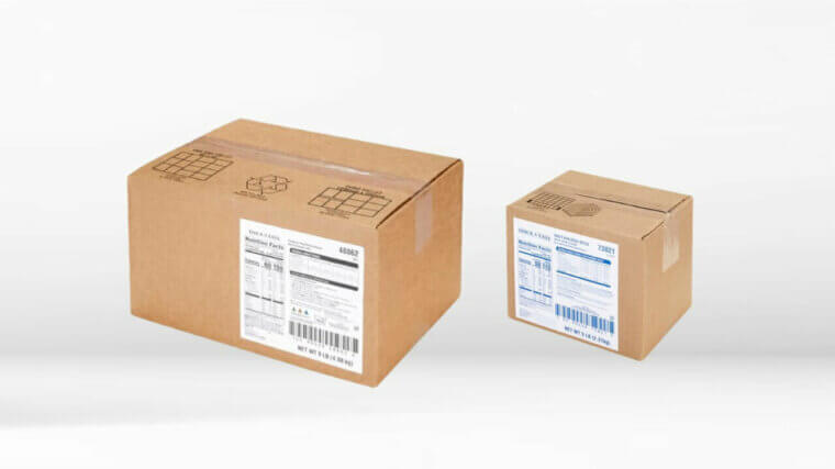 Two cardboard boxes with labels on a white background.