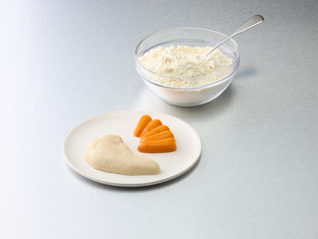 Bowl of rice with a spoon, plate with two pieces of food on a gray background.