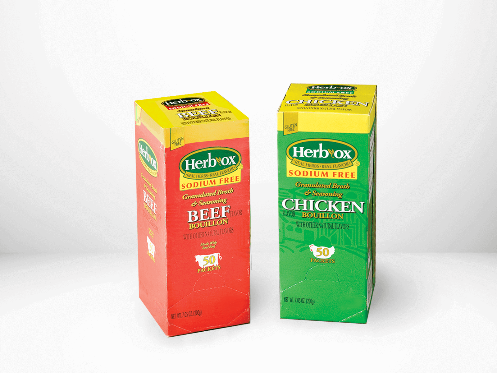 Two boxes of Herb-Ox bouillon, one red for beef and one green for chicken, on a white background.