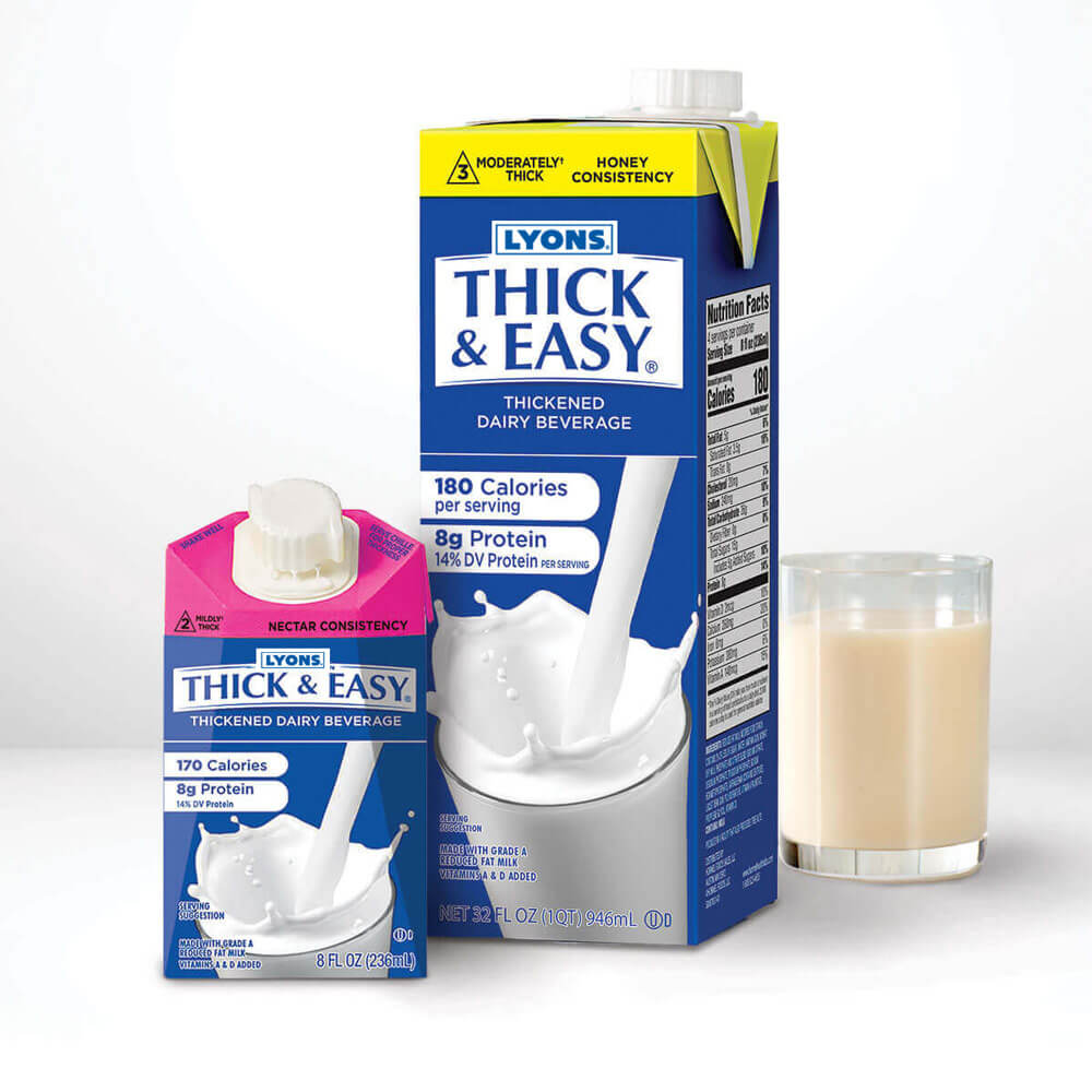 Two cartons of Lyons Thick & Easy thickened dairy beverage with a glass of the product on a white background.