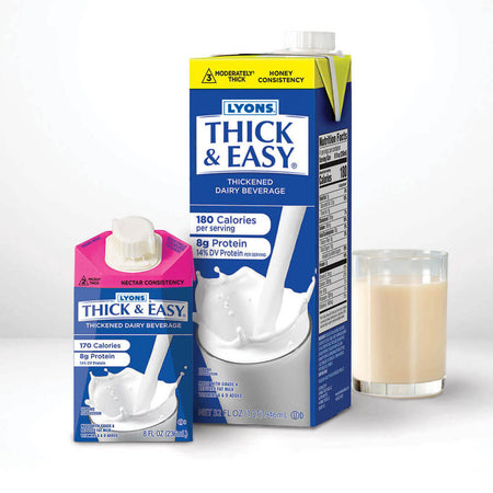 Two cartons of Lyons Thick & Easy thickened dairy beverage with a glass of the product on a white background.